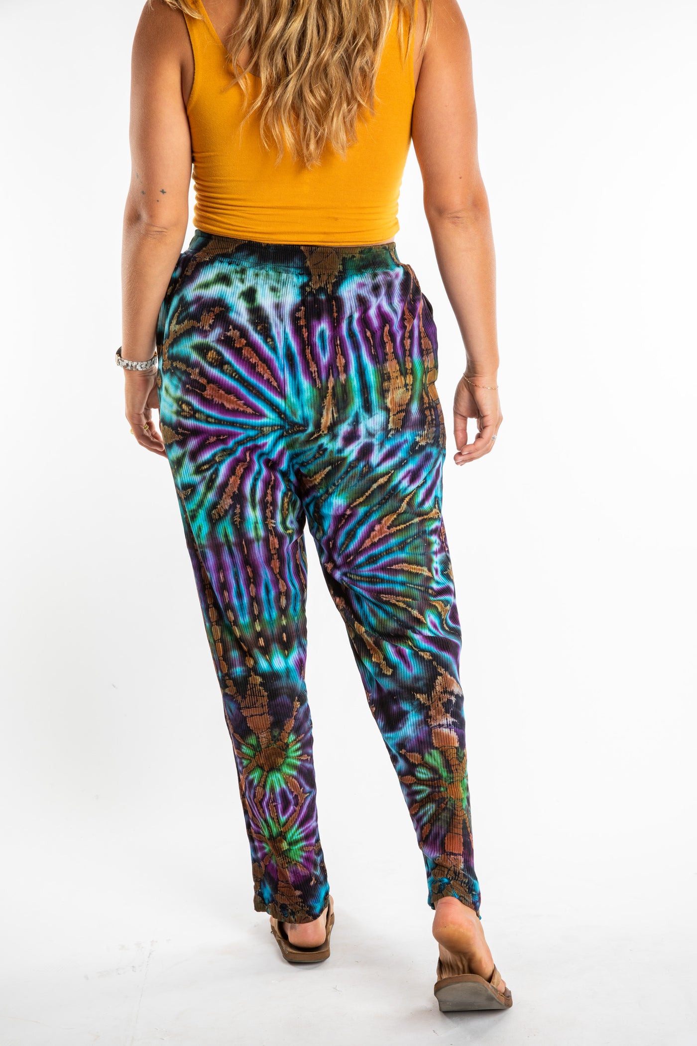Sophie wearing blue tie dye pants in Black Orange