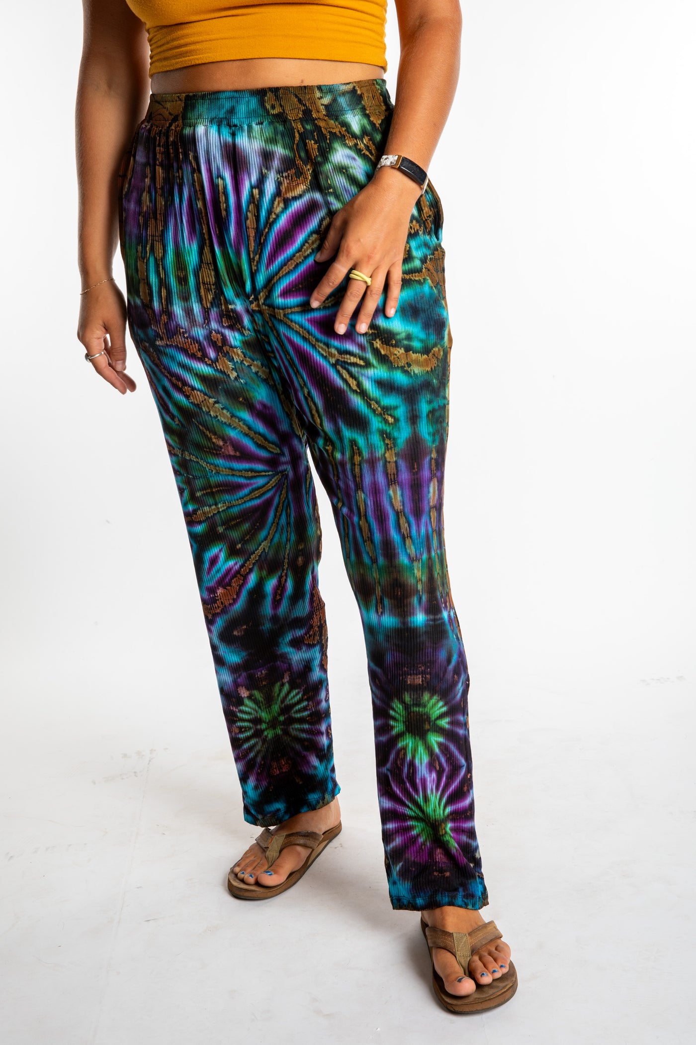 Sophie wearing blue tie dye pants in Black Orange