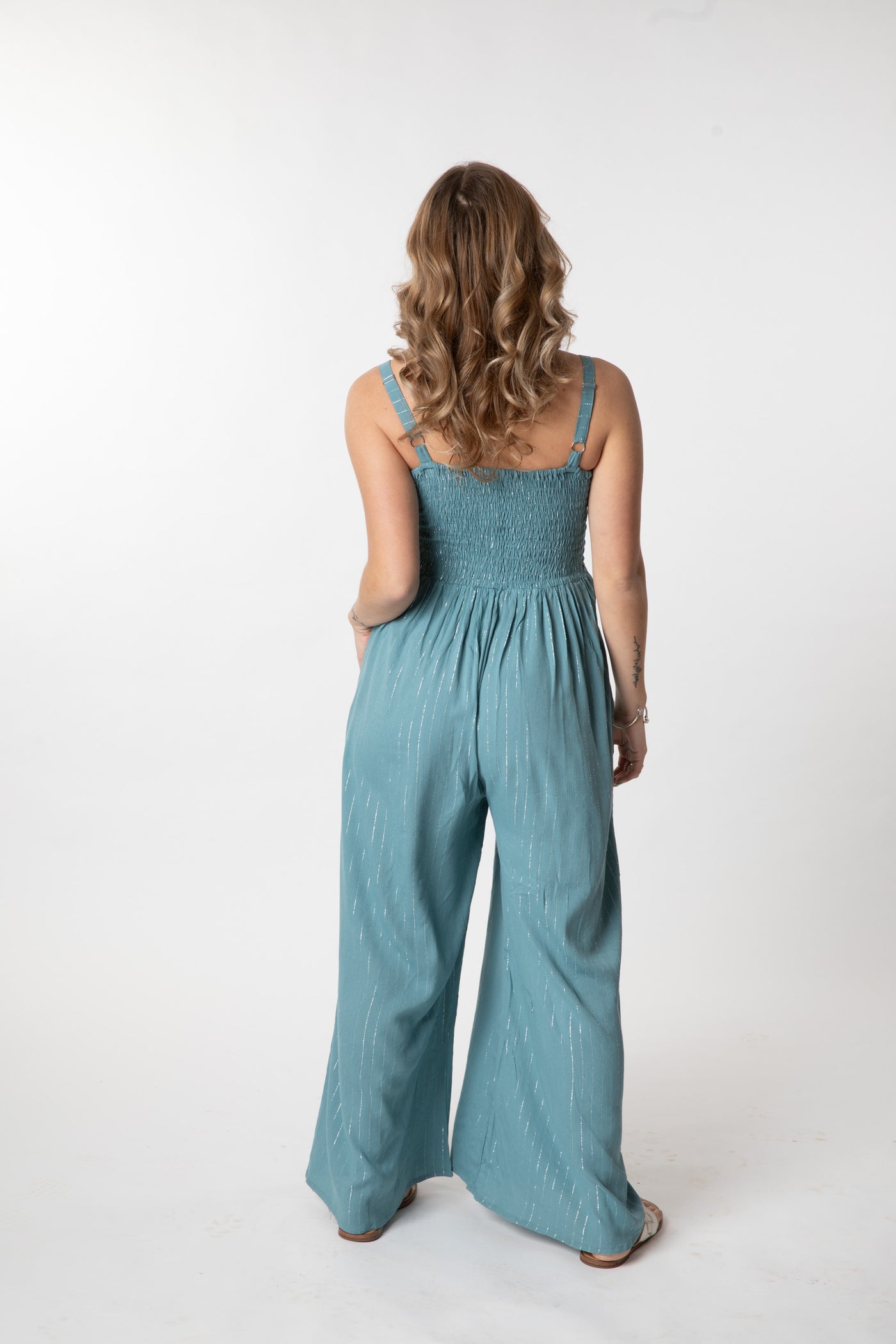 Jacalyn is wearing size S/M jumpsuit in sea blue 