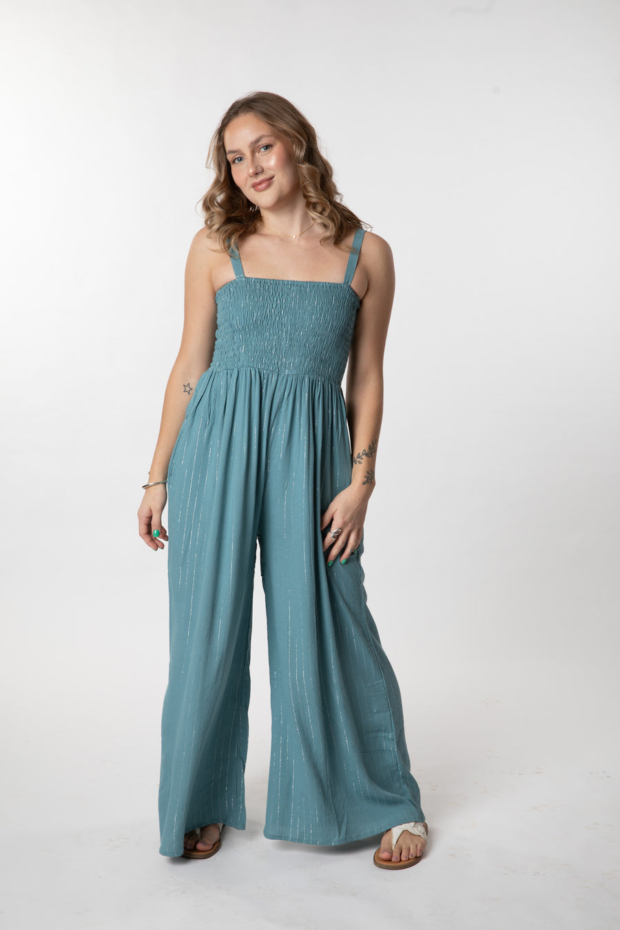 Jacalyn is wearing size S/M jumpsuit in sea blue 