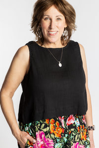 Betty wearing L/XL black sleeveless cotton top with textured fabric and relaxed fit