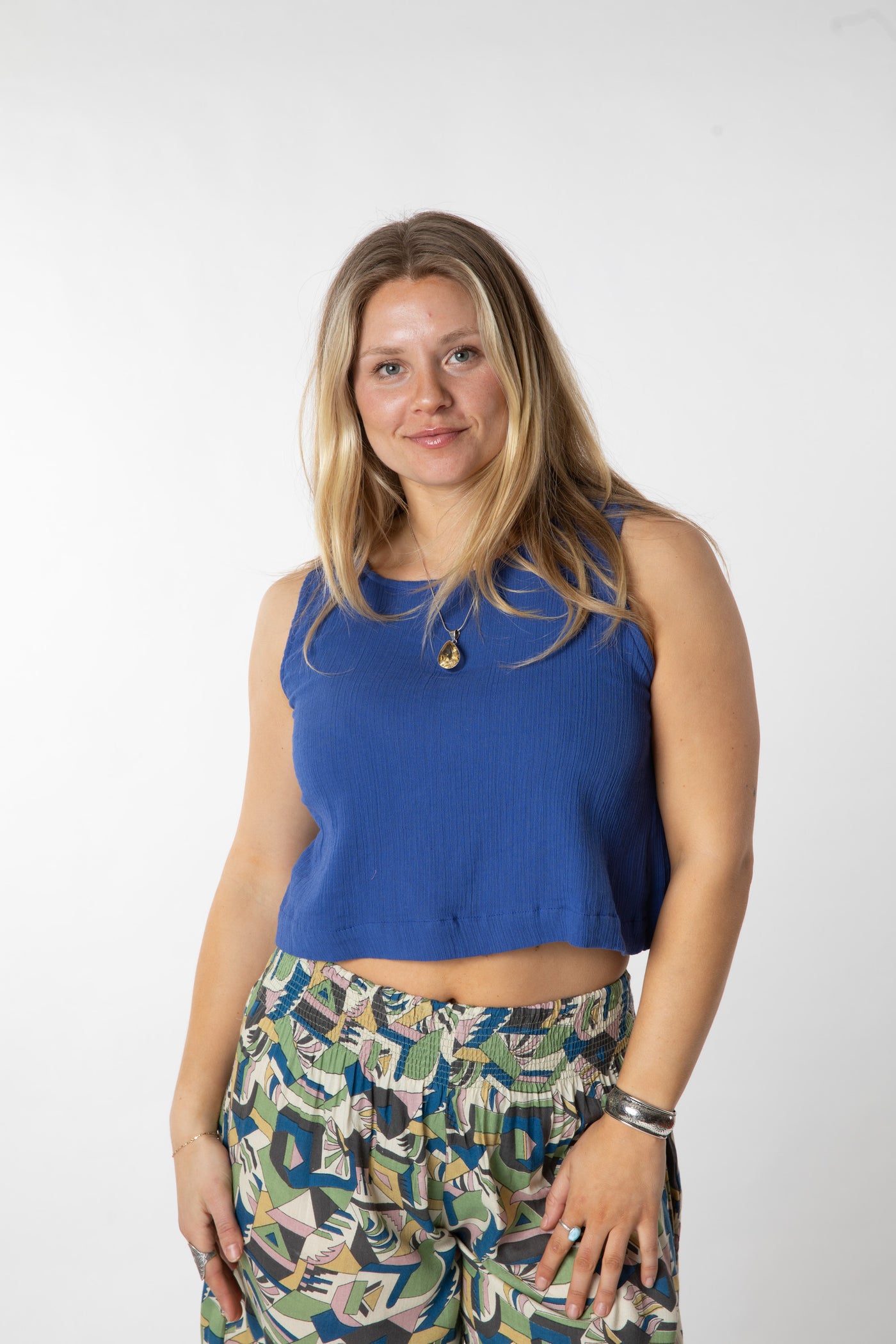 Sophie is wearing size S cotton tank top in cobalt