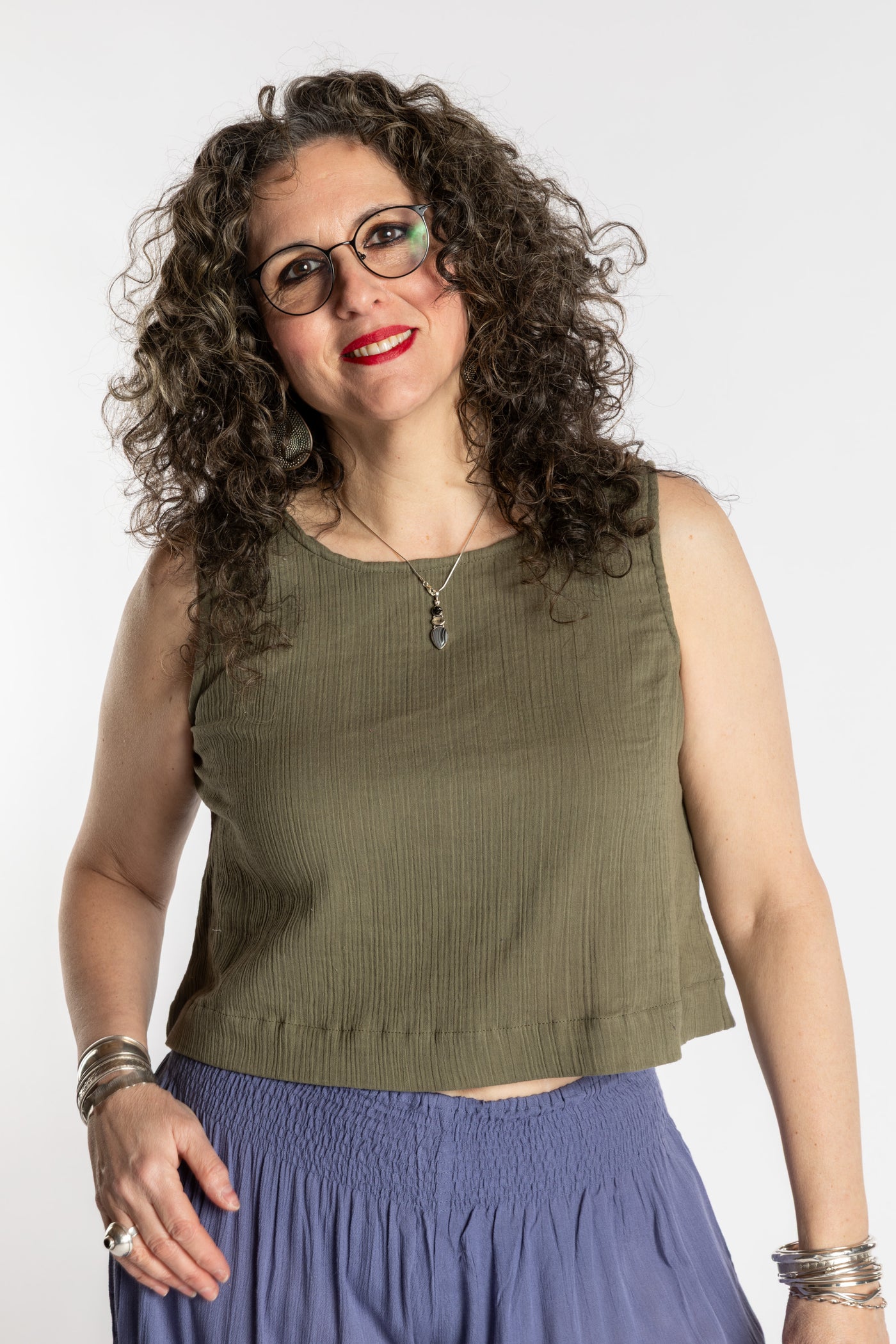 Susan wearing M/L olive green sleeveless cotton top with textured fabric and relaxed fit
