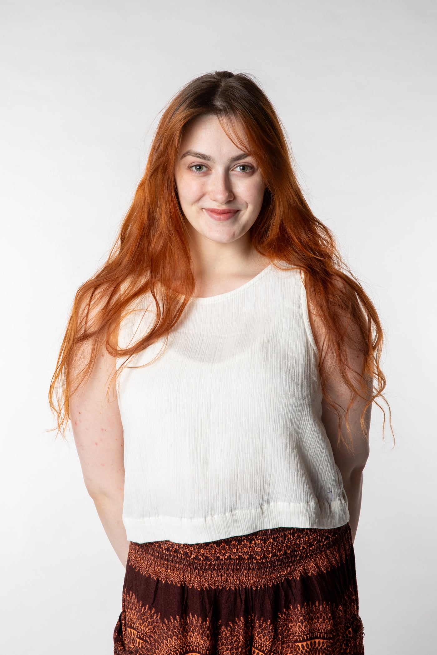 Honora is wearing size S cotton tank top in ivory
