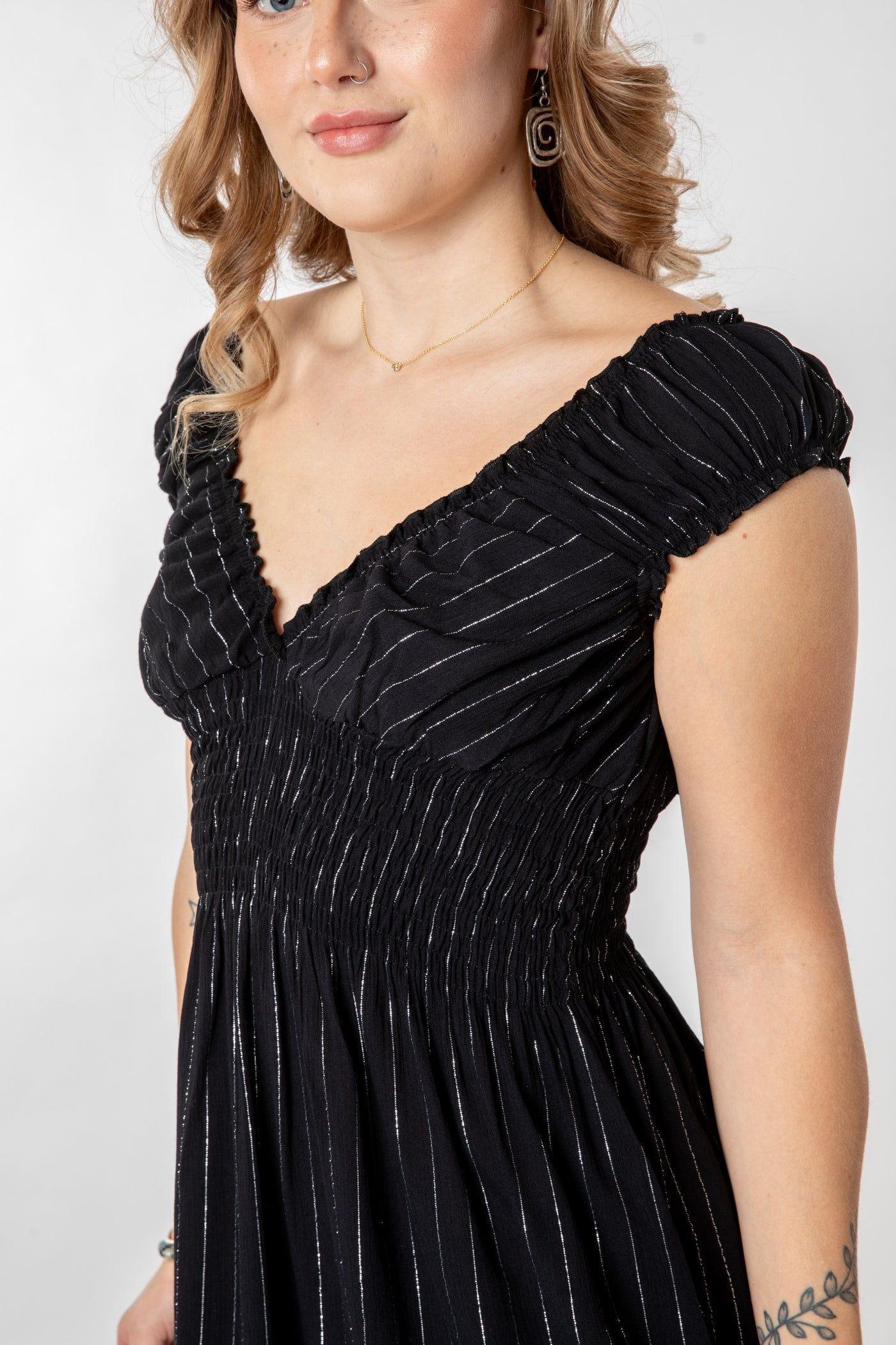 Jacalyn is wearing size S/M babydoll dress in black