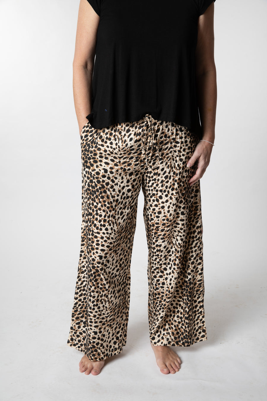 Sophie is wearing wide leg pants in leopard