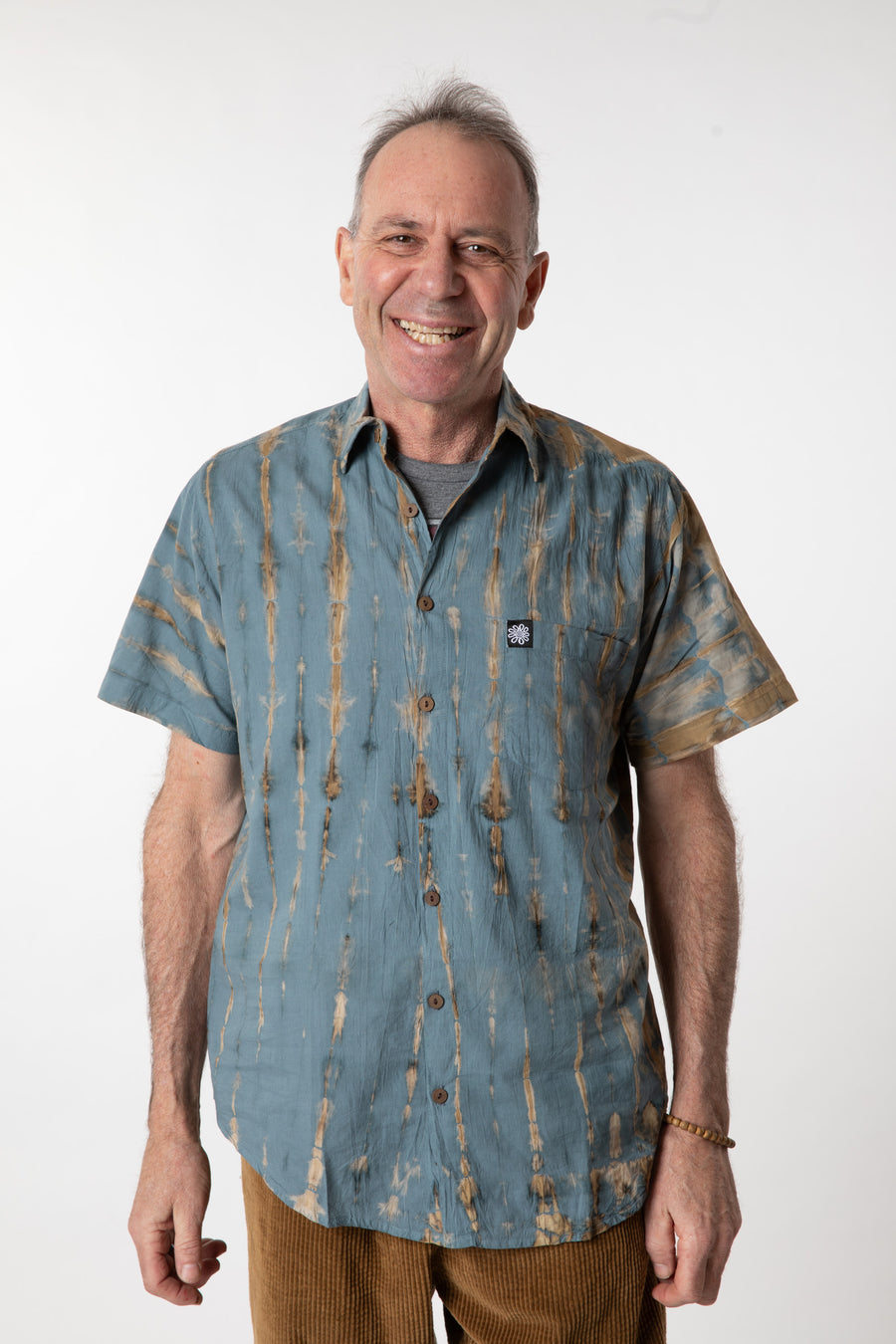 Ross is wearing size M cotton tie dye button up shirt in slate