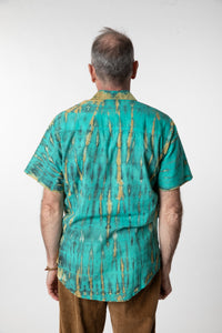 Ross is wearing size M cotton tie dye button up shirt in turquoise