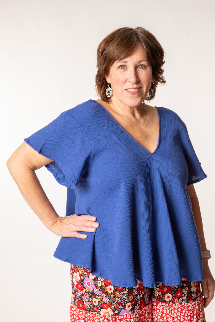 Betty is wearing a cotton top in cobalt