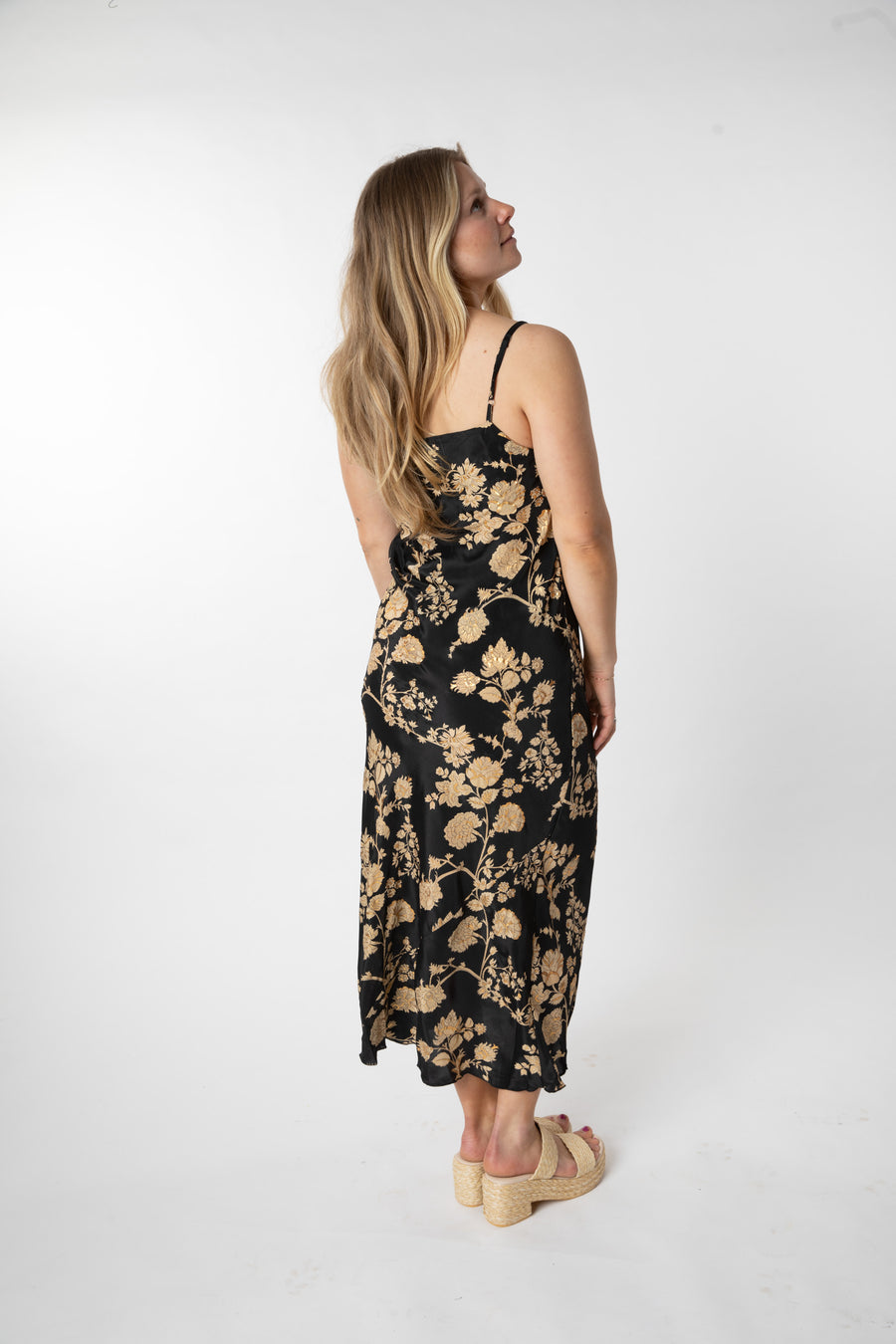 Sophie is wearing a size S/M maxi dress in Black Floral