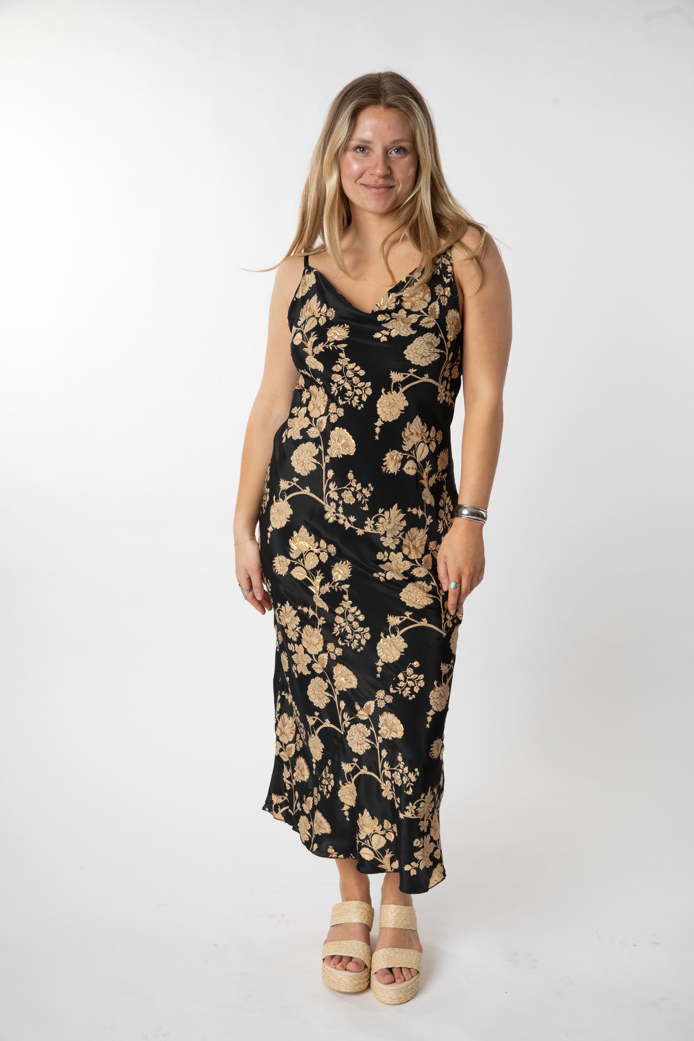 Sophie is wearing a size S/M maxi dress in Black Floral