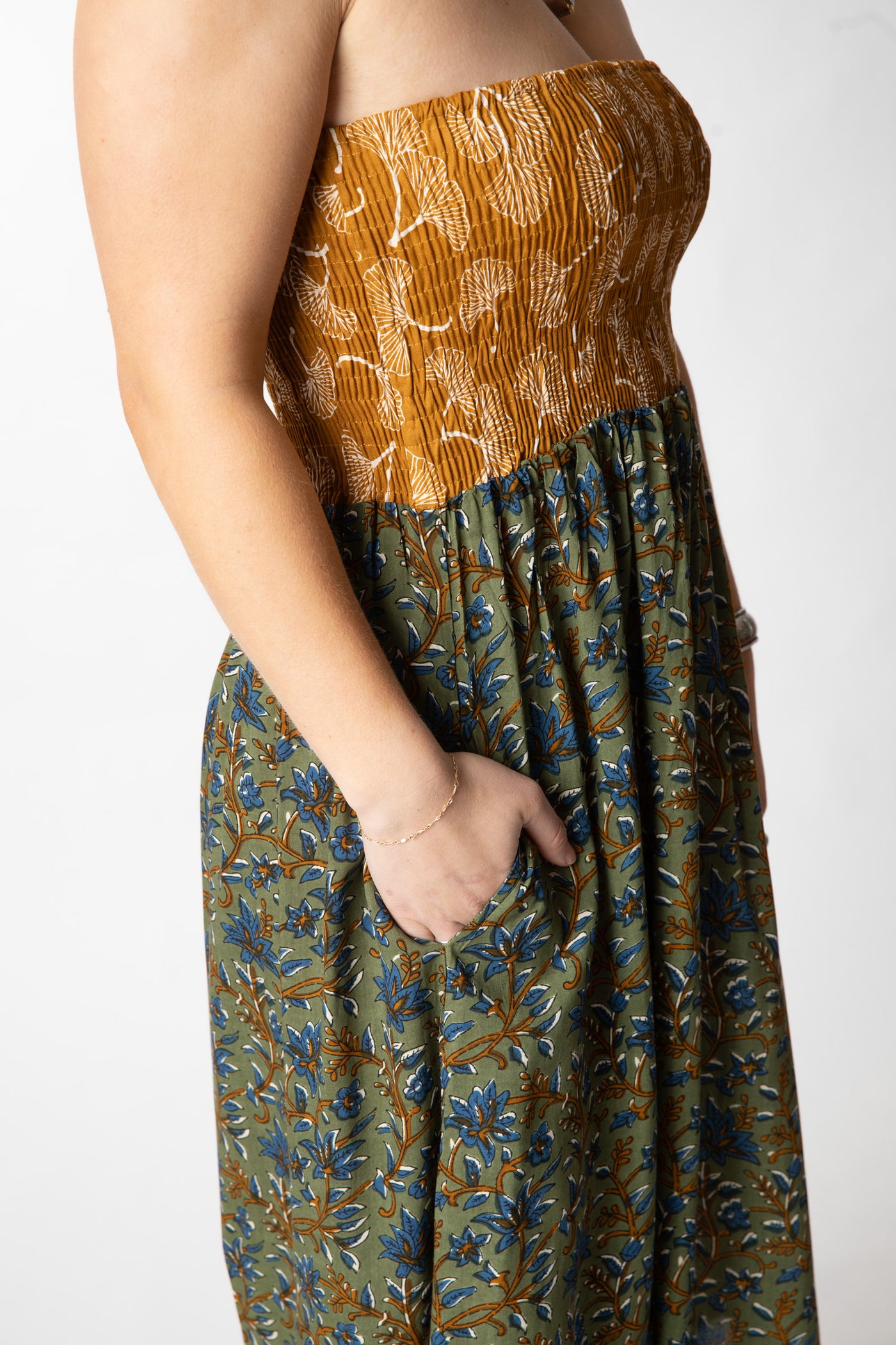 Sophie is wearing a convertible dress in sage floral