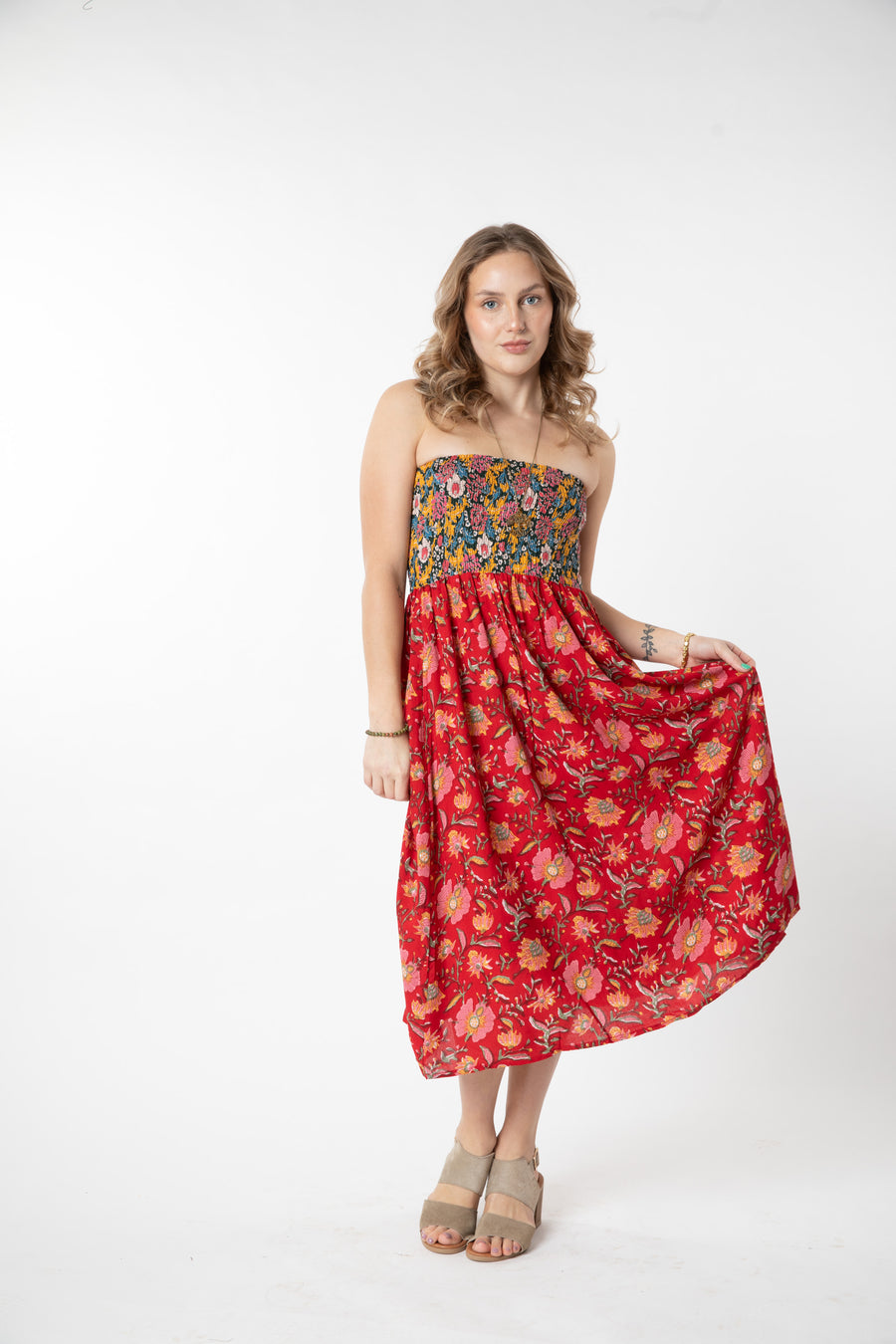 Jacalyn is wearing a convertible dress in scarlet floral