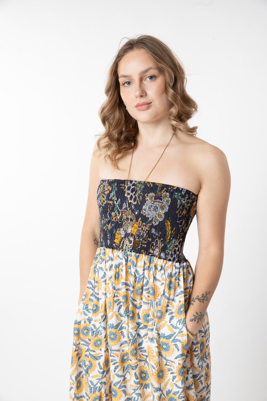 Jacalyn is wearing a convertible dress in sunflower