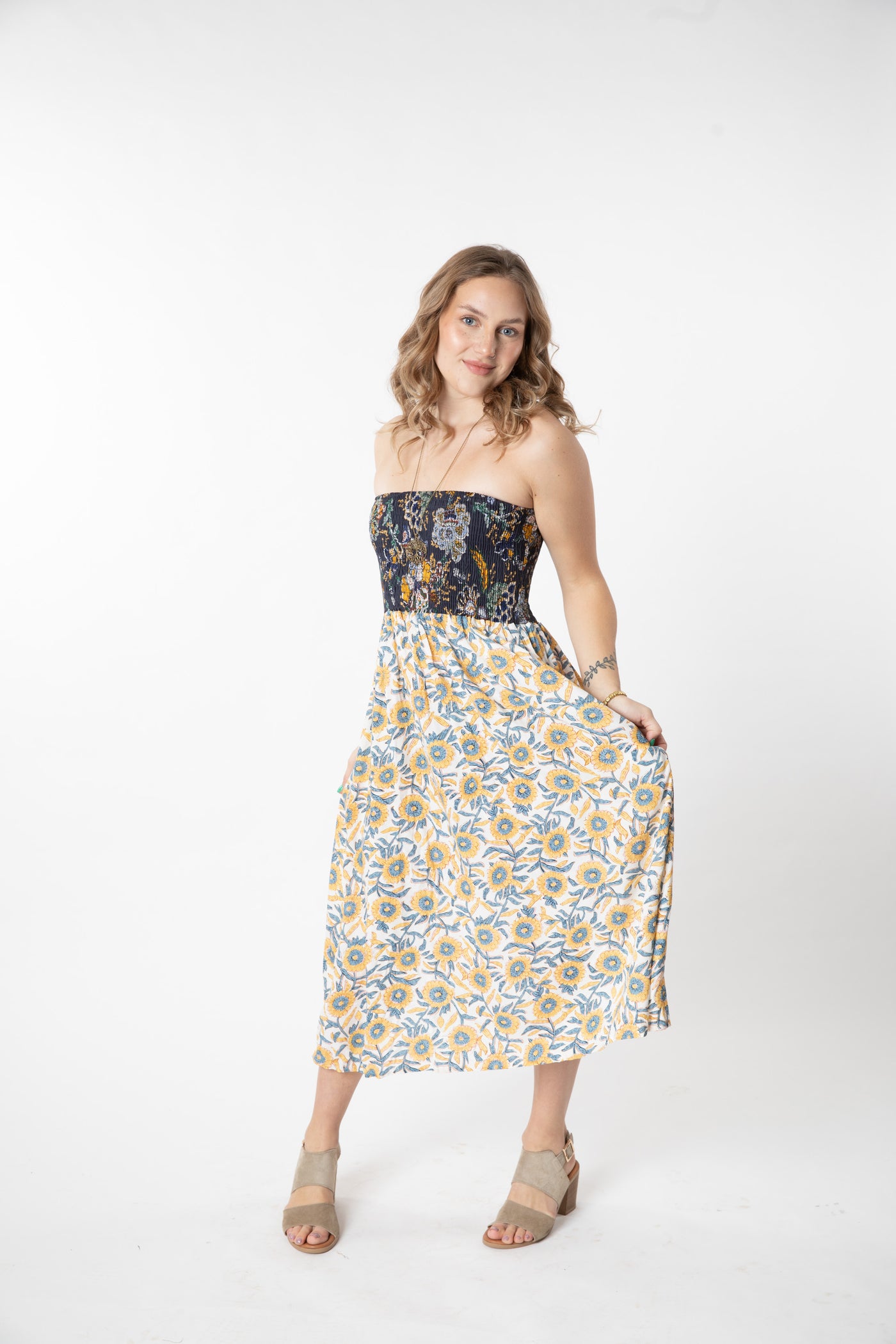 Jacalyn is wearing a convertible dress in sunflower