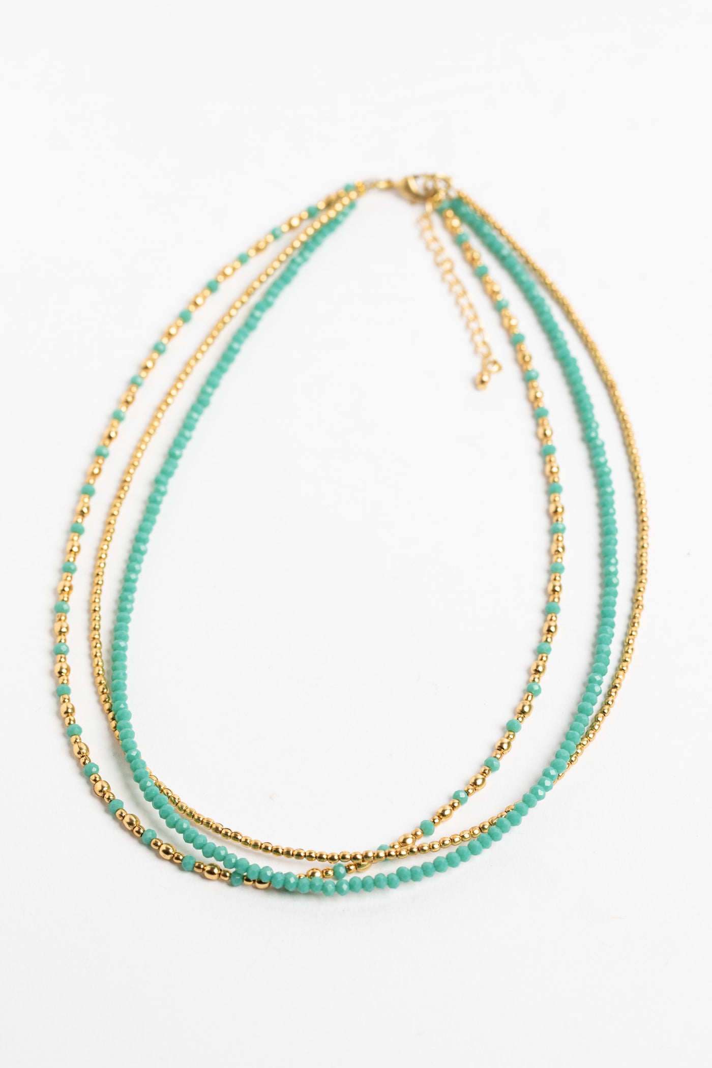 layered beaded necklace in tuquoise on white background