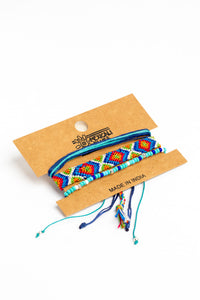 boho friendship bracelet set in blue on white background
