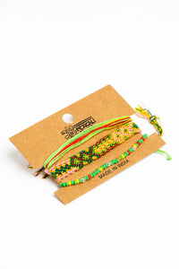  boho friendship bracelet set in green on white background
