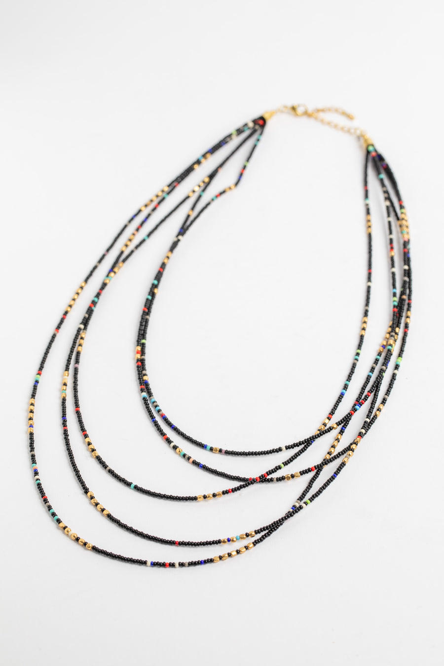 multi strand beaded necklace in black on white background