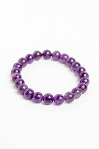 stretch beaded gemstone bracelet in amethyst on white background