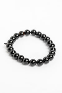 stretch beaded gemstone bracelet in black onyx on white background