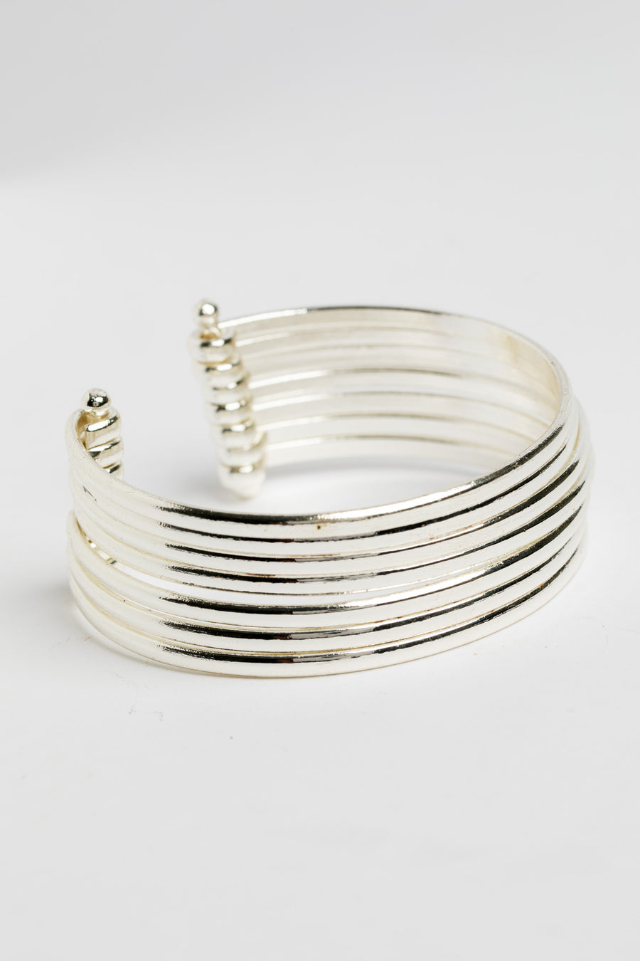 Bold statement wrist cuff in silver on white background