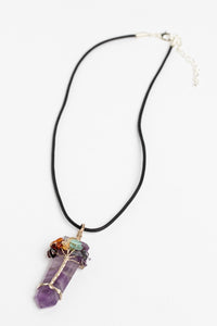 tree of life crystal necklace pendant in amethyst on white background