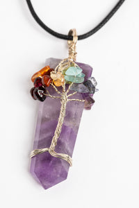 tree of life crystal necklace pendant in amethyst on white background