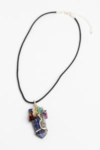 tree of life crystal necklace pendant in lapis on white background