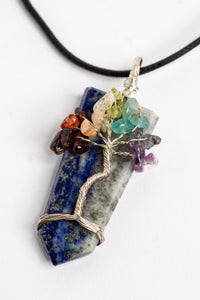 tree of life crystal necklace pendant in lapis on white background