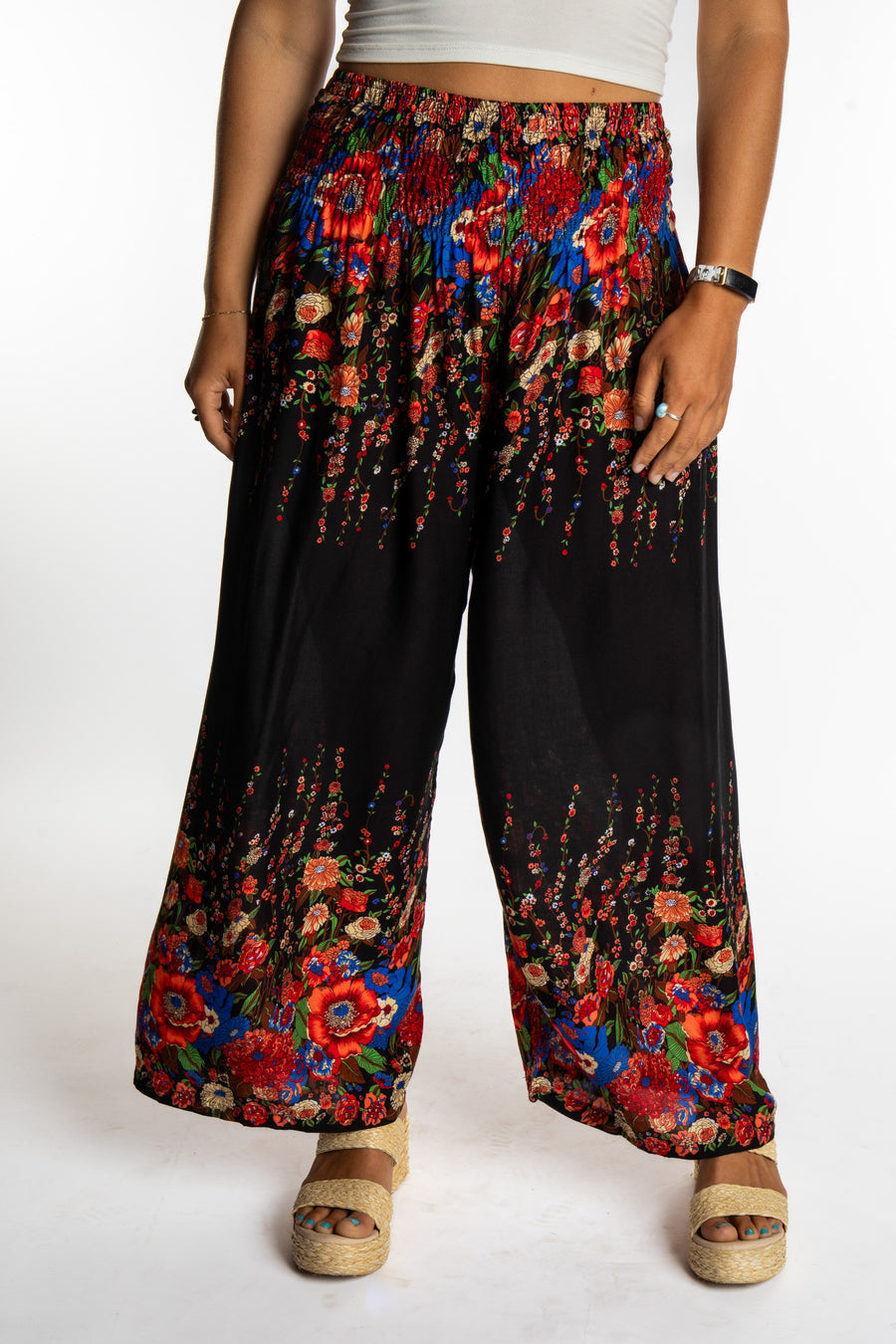 Sophie is wearing floral palazzo pants in black
