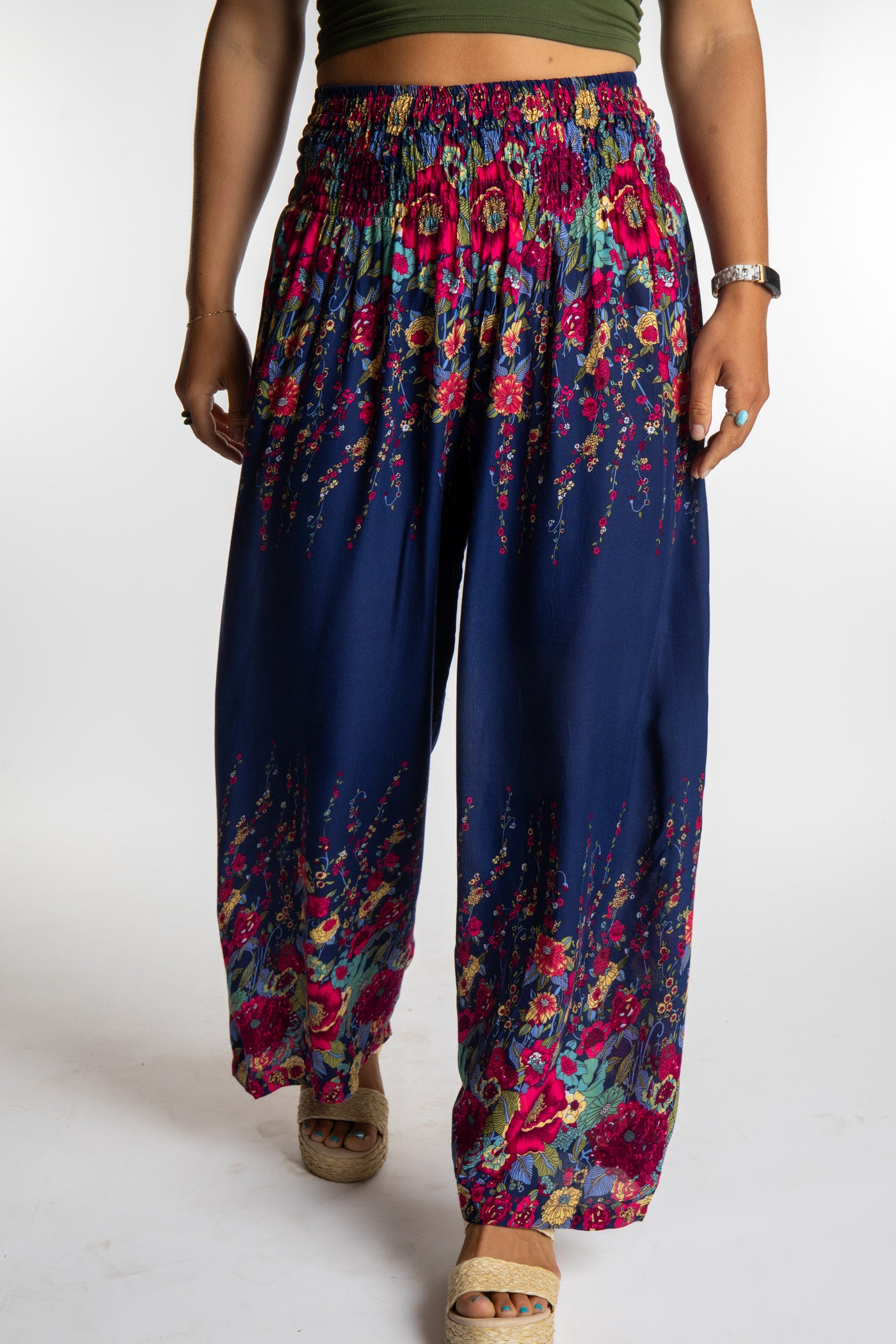 Sophie is wearing floral palazzo pants in navy