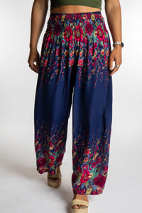 Sophie is wearing floral palazzo pants in navy