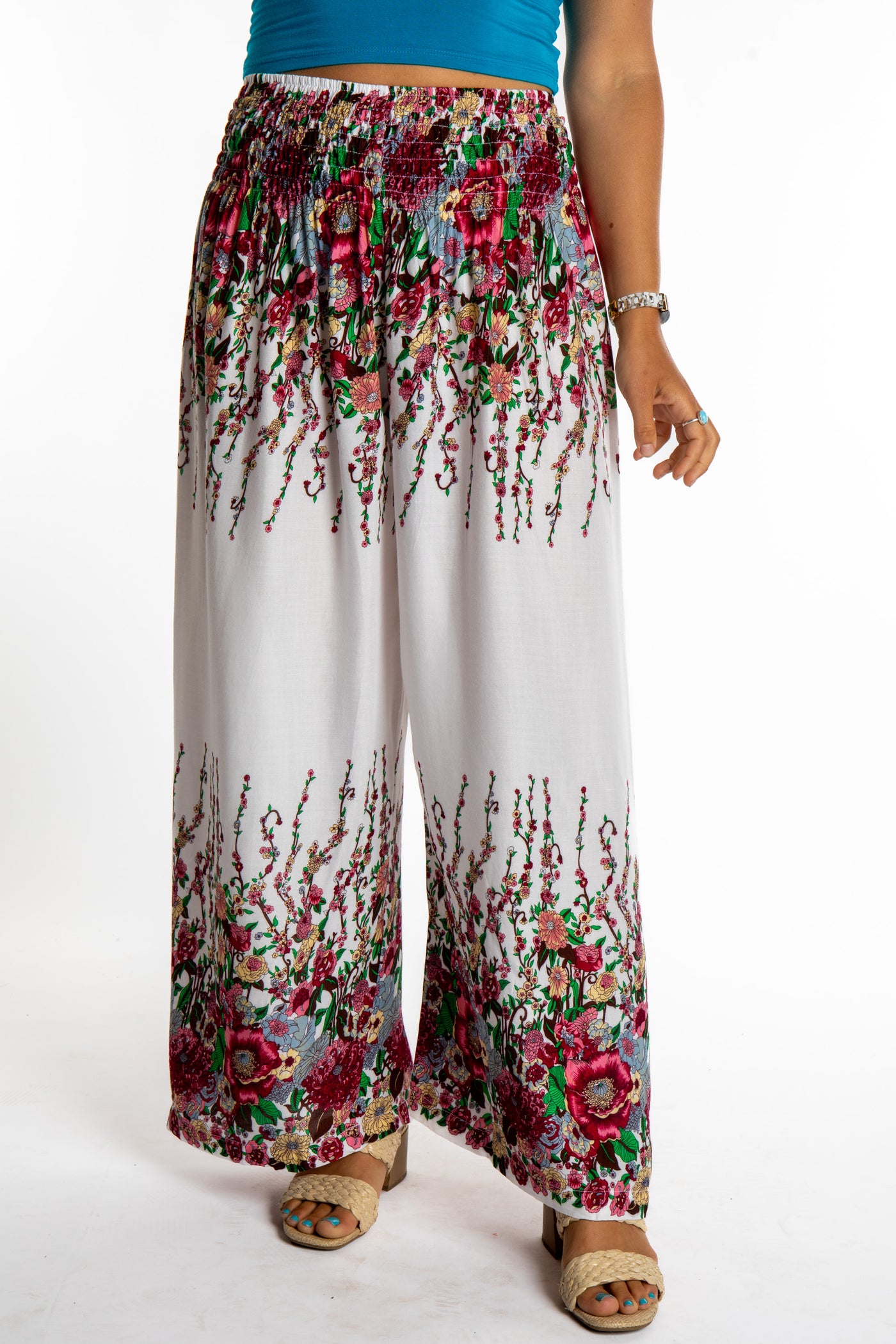 Sophie is wearing floral palazzo pants in white