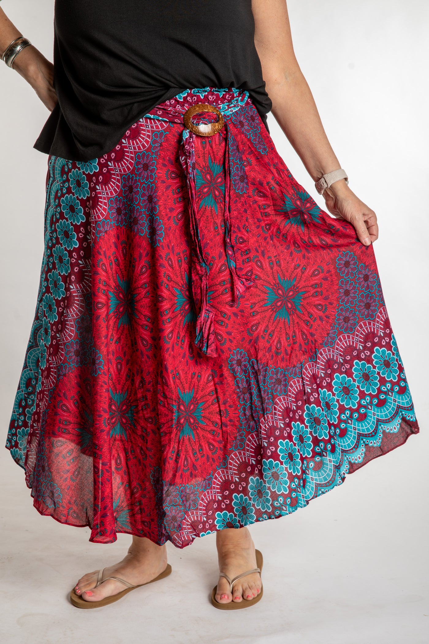 Betty is wearing floral skirt in rose