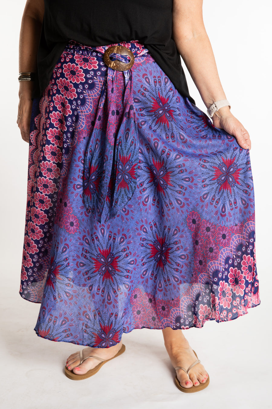 Betty is wearing floral skirt in purple