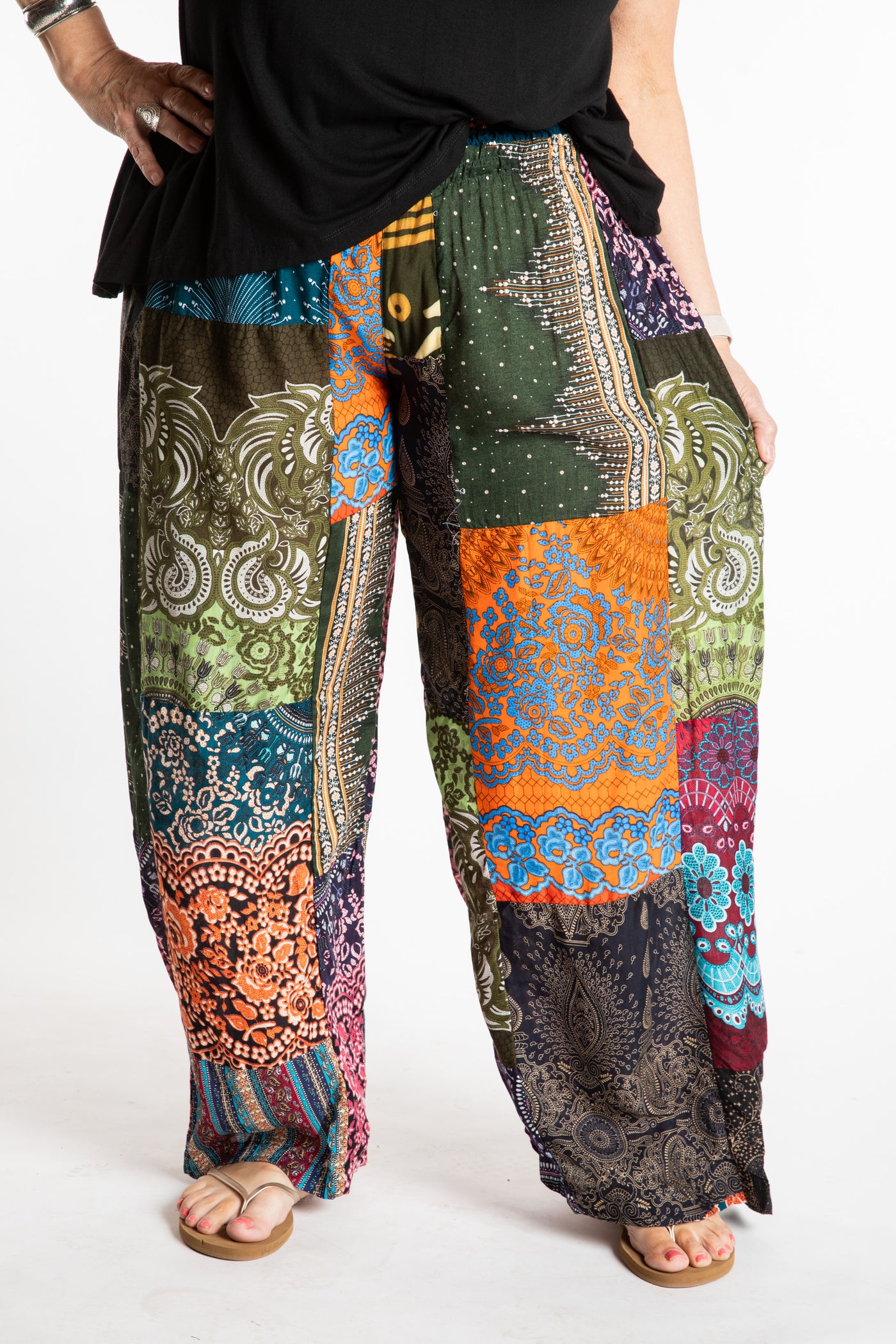 Betty is wearing patchwork palazzo pants.