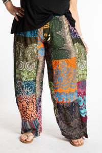 Betty is wearing patchwork palazzo pants.
