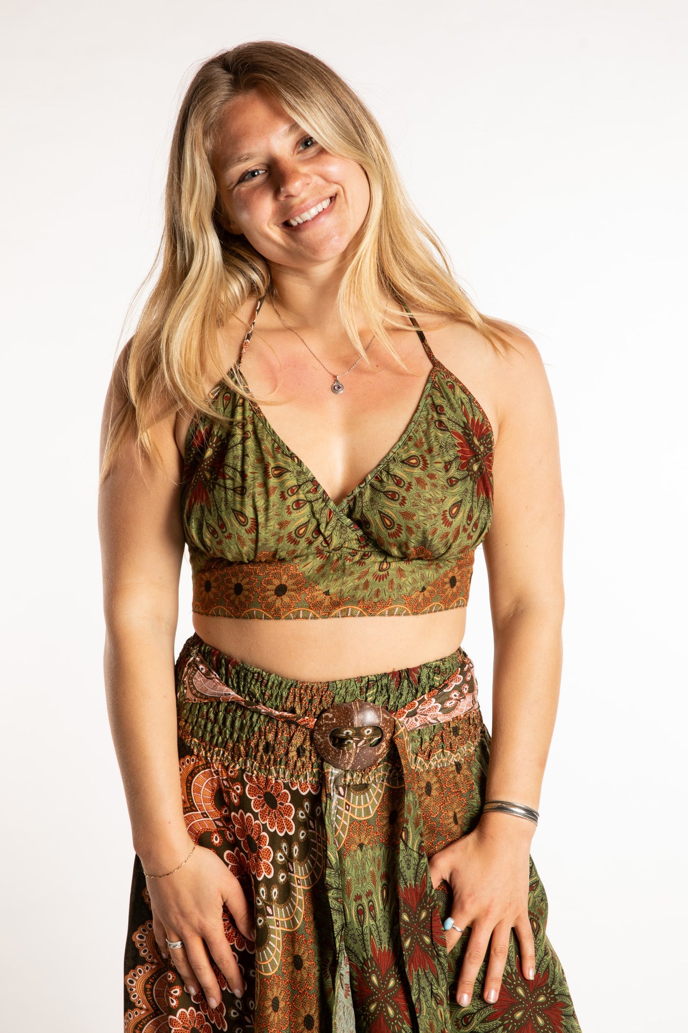 Sophie is wearing a printed halter top in Green 