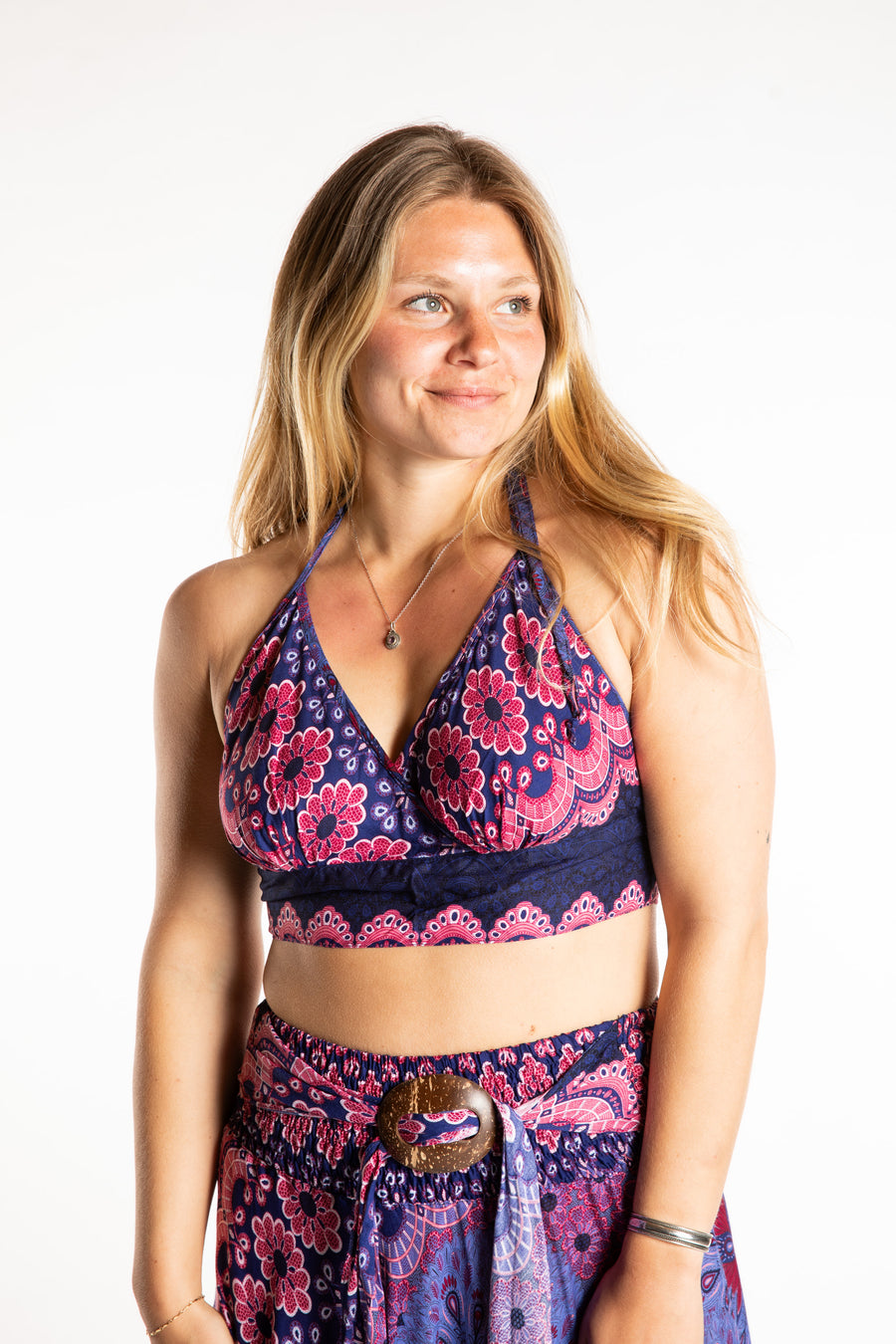Sophie is wearing a printed halter top in Purple and Pink