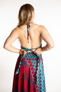 Sophie is wearing a printed halter top in Rose and Turquoise