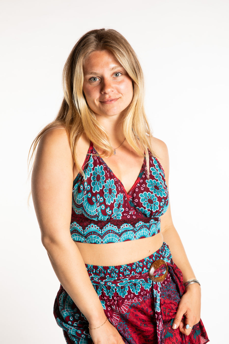 Sophie is wearing a printed halter top in Rose and Turquoise