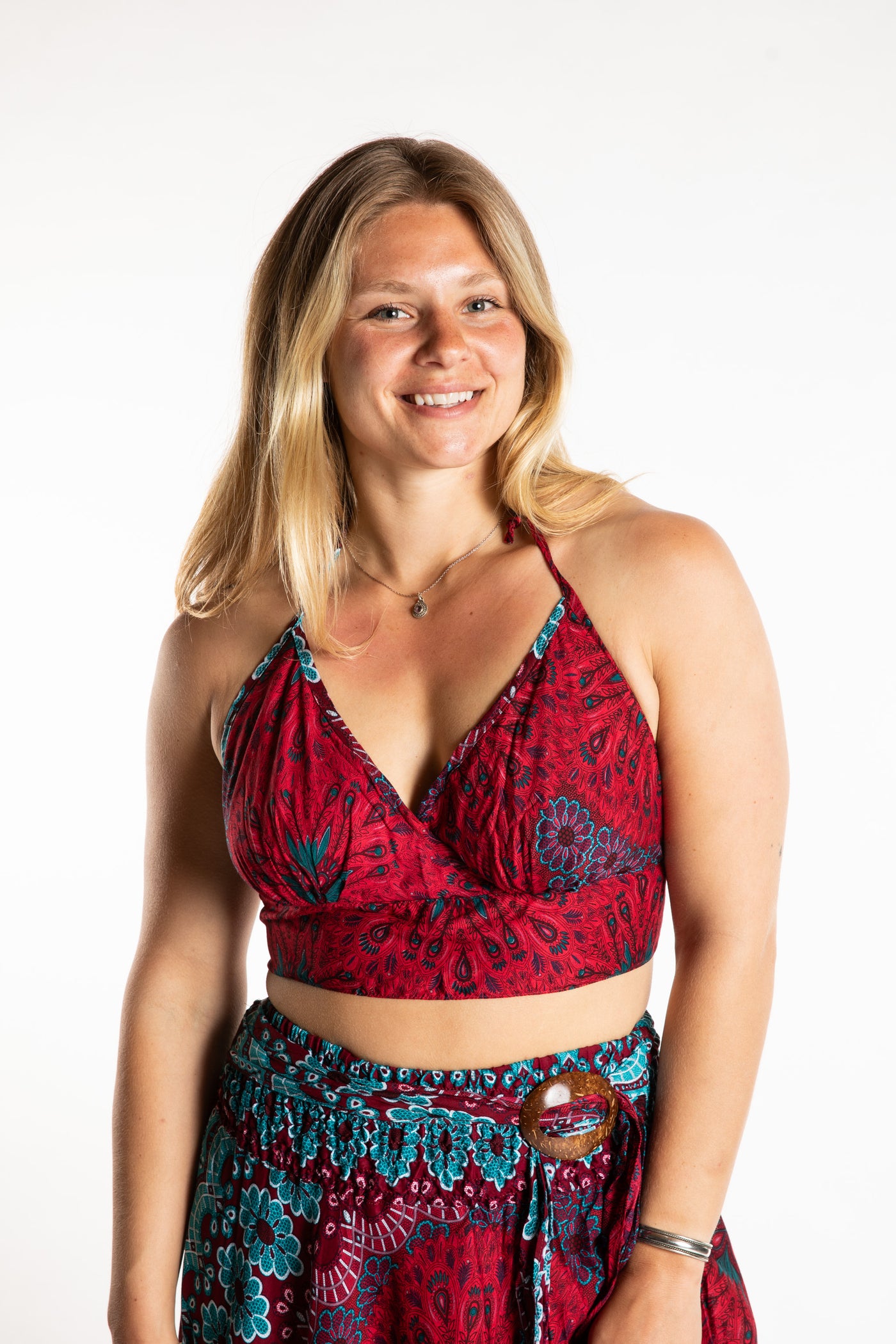 Sophie is wearing a printed halter top in Rose 