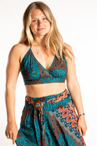 Sophie is wearing a printed halter top in Teal 