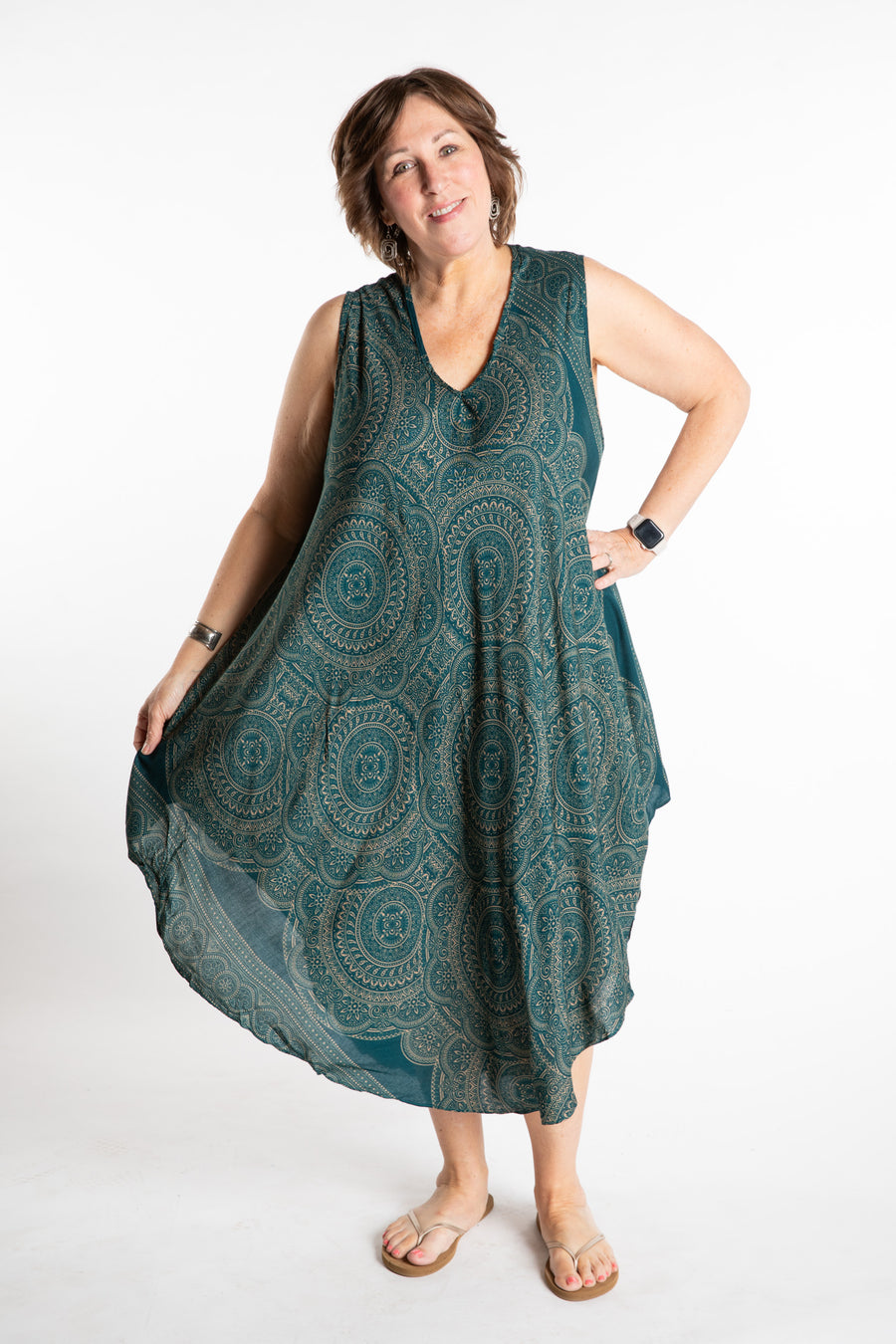 Betty is wearing a flowy dress in Teal