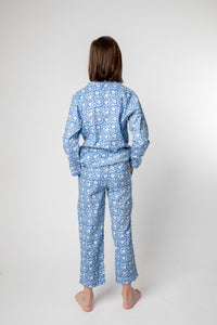 Violet is wearing size 8/9 pajama set in blue poppies