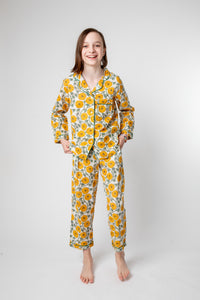 Violet is wearing size 8/9 pajama set in dandelion