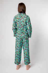 Violet is wearing size 8/9 pajama set in turquoise rosa