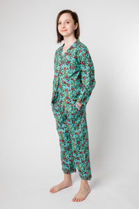 Violet is wearing size 8/9 pajama set in turquoise rosa
