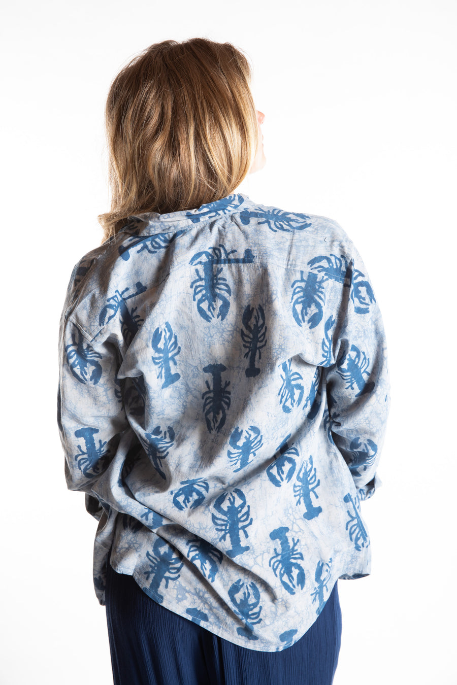 Sophie is wearing size S lobster print button up in blue